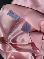 Serenquor 100% Mulberry Silk Pillowcase in Light Pink featuring brand label, care instructions and 22 Momme Grade 6A silk fabric