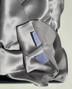 Serenquor 100% Mulberry Silk Pillowcase in Silver featuring envelope closure, brand label and premium 22 Momme Grade 6A silk fabric