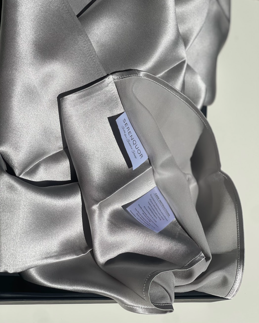 Serenquor 100% Mulberry Silk Pillowcase in Silver featuring envelope closure, brand label and premium 22 Momme Grade 6A silk fabric