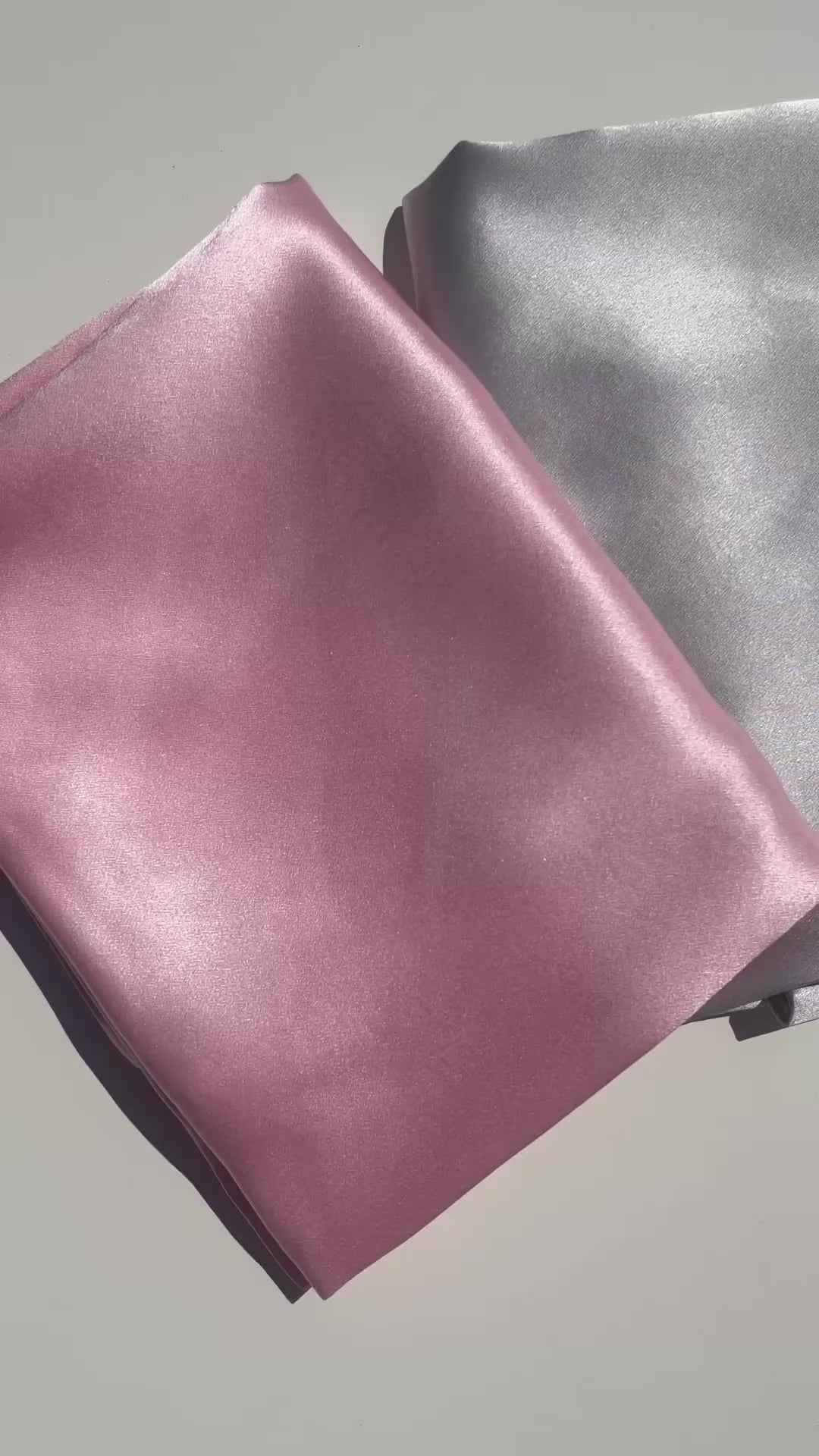 Close up video of a 22 momme 100% Mulberry silk pillowcase showing the smooth luxurious silk fabric and natural shine