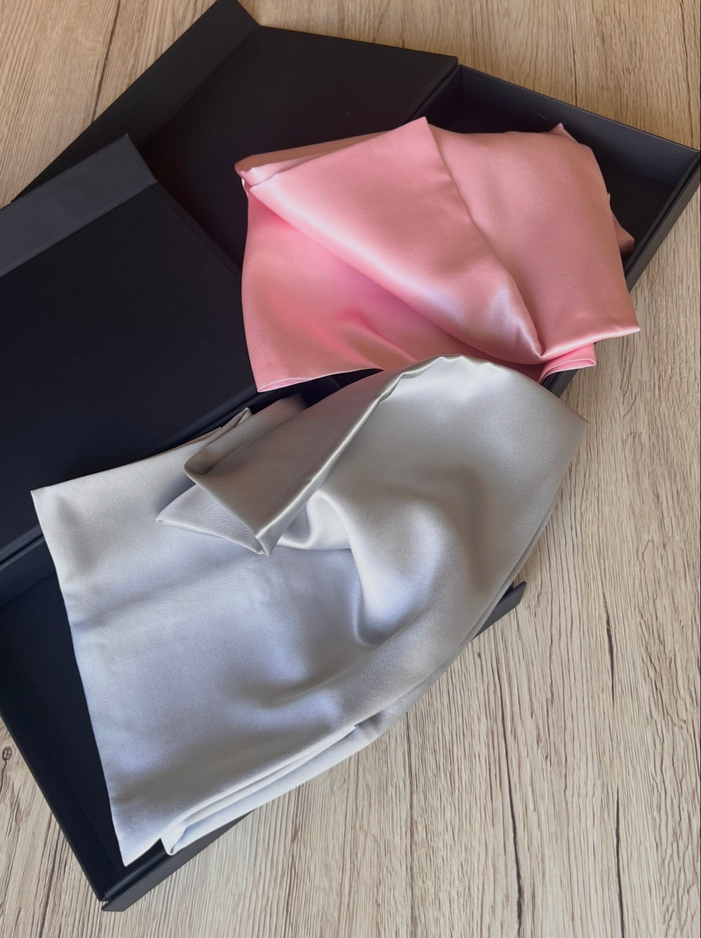 Pink and silver 100% Mulberry silk pillowcases by Serenquor displayed in premium gift boxes representing quality craftsmanship timeless design and everyday luxury